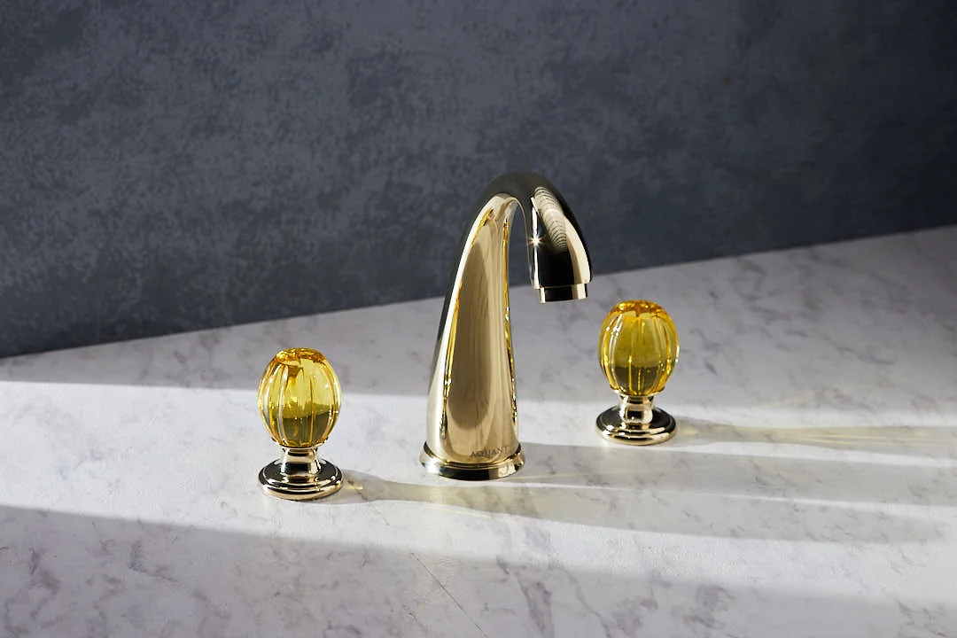 Aquant Statement Three-Hole Basin Mixer, Crystal Handles · Gold · Amber crystal — Deck-mounted three-hole mixer with crystal handles.