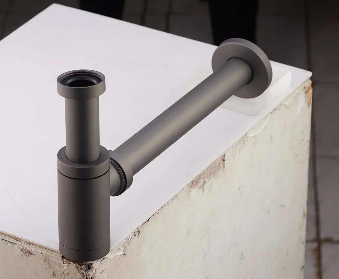 Aquant 1003 GG Brass Bottle Trap · Graphite Grey — Exposed bottle trap for wall-hung basins.